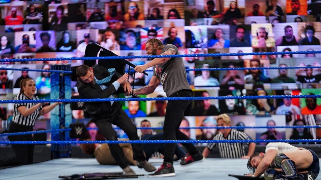 WWE's tweet photo. To say that @EdgeRatedR is "unhappy" about @WWEDanielBryan joining the #UniversalTitle bout at #WrestleMania would be an absolute understatement. #SmackDown @WWERomanReigns @HeymanHustle https://t.co/StkWzMzTRa