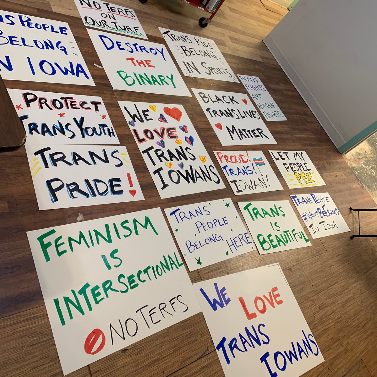 LGBTQIowa's tweet photo. Our volunteers lovingly made posters for this Wednesday’s 5pm #TransDayOfVisibility rally happening in Iowa City on the Pentacrest. Join us and you can hold one of these beauties or bring your own poster! #ProtectTransYouth https://t.co/34X9yODcIW