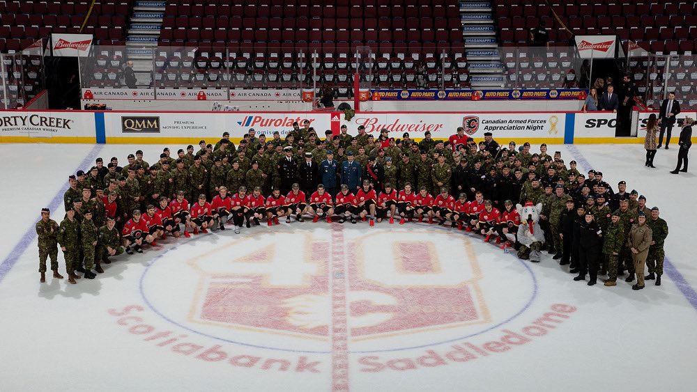 ashlegodebt's tweet photo. Would rather be in the @YYCSaddledome tonight cheering on the @NHLFlames for the mil appreciation game like I have been for the last 2 yrs, but @hockeynight will have to do until we can be back in the dome! 🇨🇦 #goflamesgo https://t.co/GhXAU8ZbMH