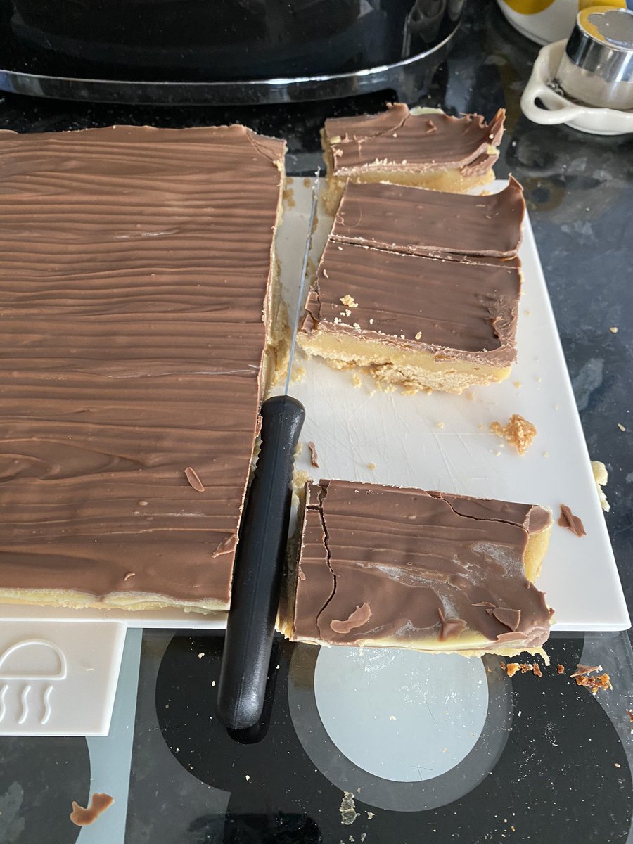 ScottHeald72's tweet photo. Last day of our holidays and Susan and I have taken on her dadβs baking bug. Fruit loaf by Susan; millionaire shortbread by me. Not bad for first attempts ππ #lockdownbakeoff https://t.co/fJUBf6DIAd