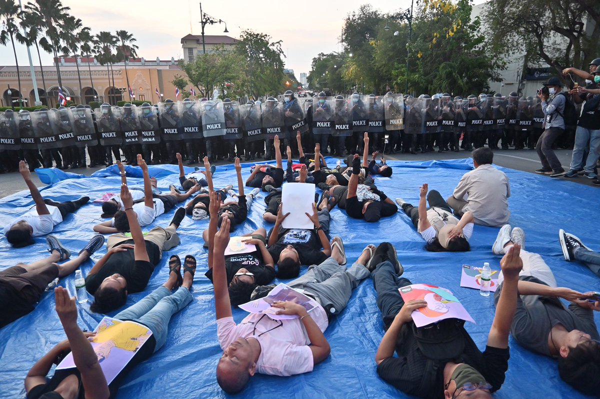 It is not immediately clear how many people have been arrested during this round of crackdown. Protesters can be seen lying on the ground, flashing a three-finger salute as riot police move in to clear the area. #หมู่บ้านทะลุฟ้า #ม็อบ28กุมภา