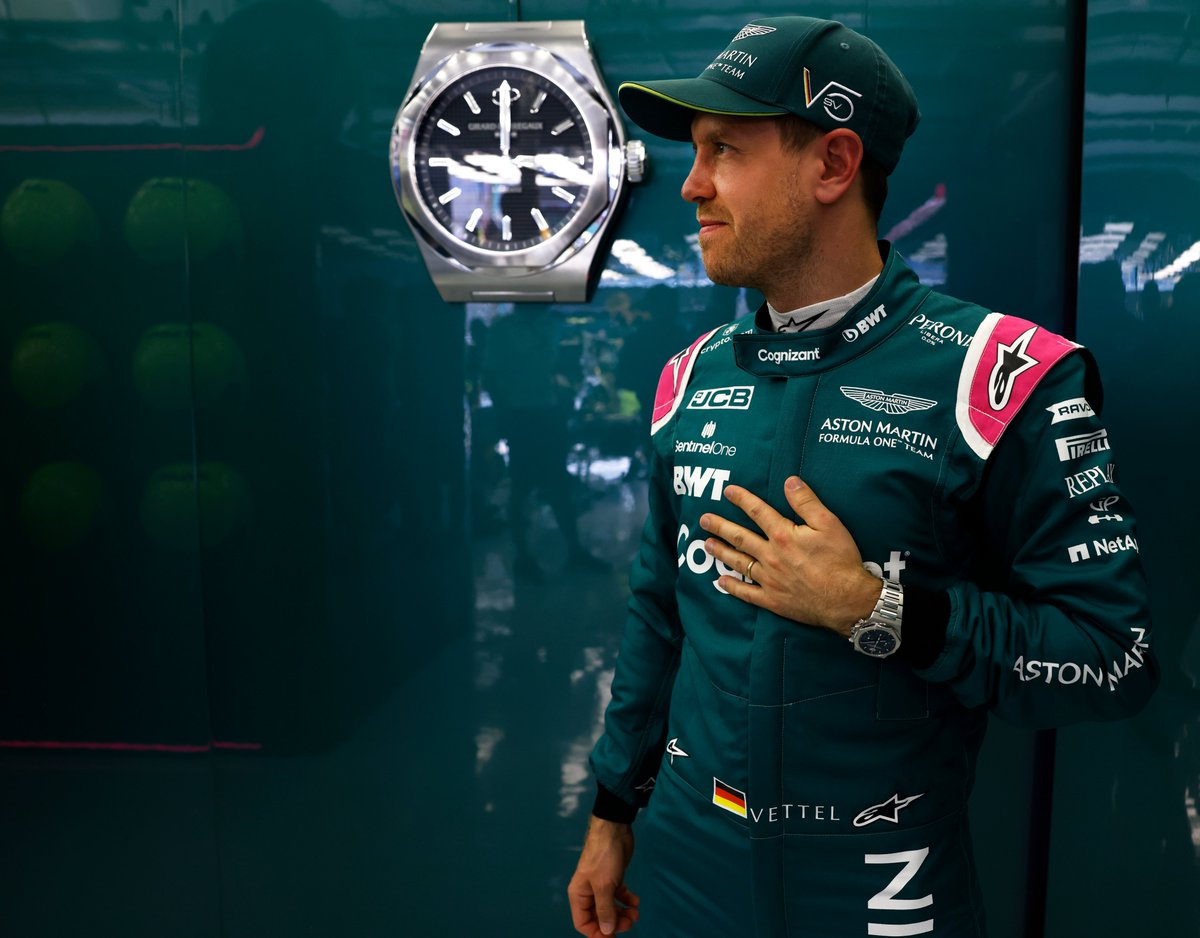 AstonMartinF1's tweet photo. Time to race. 

Just one hour to go until the lights go out for the first time this year. @GirardPerregaux is keeping us on time. 👌

#BahrainGP https://t.co/uTr6IoSIhN