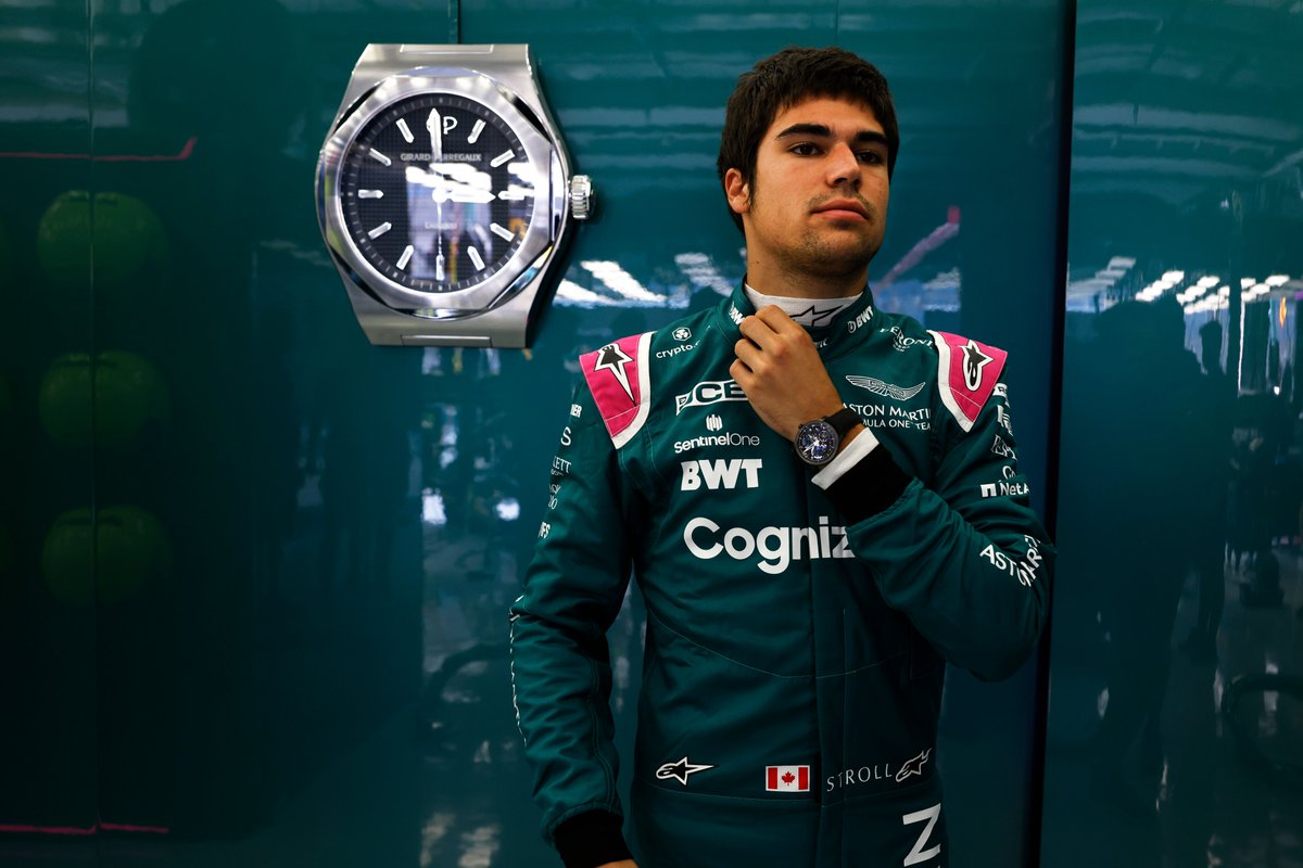 AstonMartinF1's tweet photo. Time to race. 

Just one hour to go until the lights go out for the first time this year. @GirardPerregaux is keeping us on time. 👌

#BahrainGP https://t.co/uTr6IoSIhN