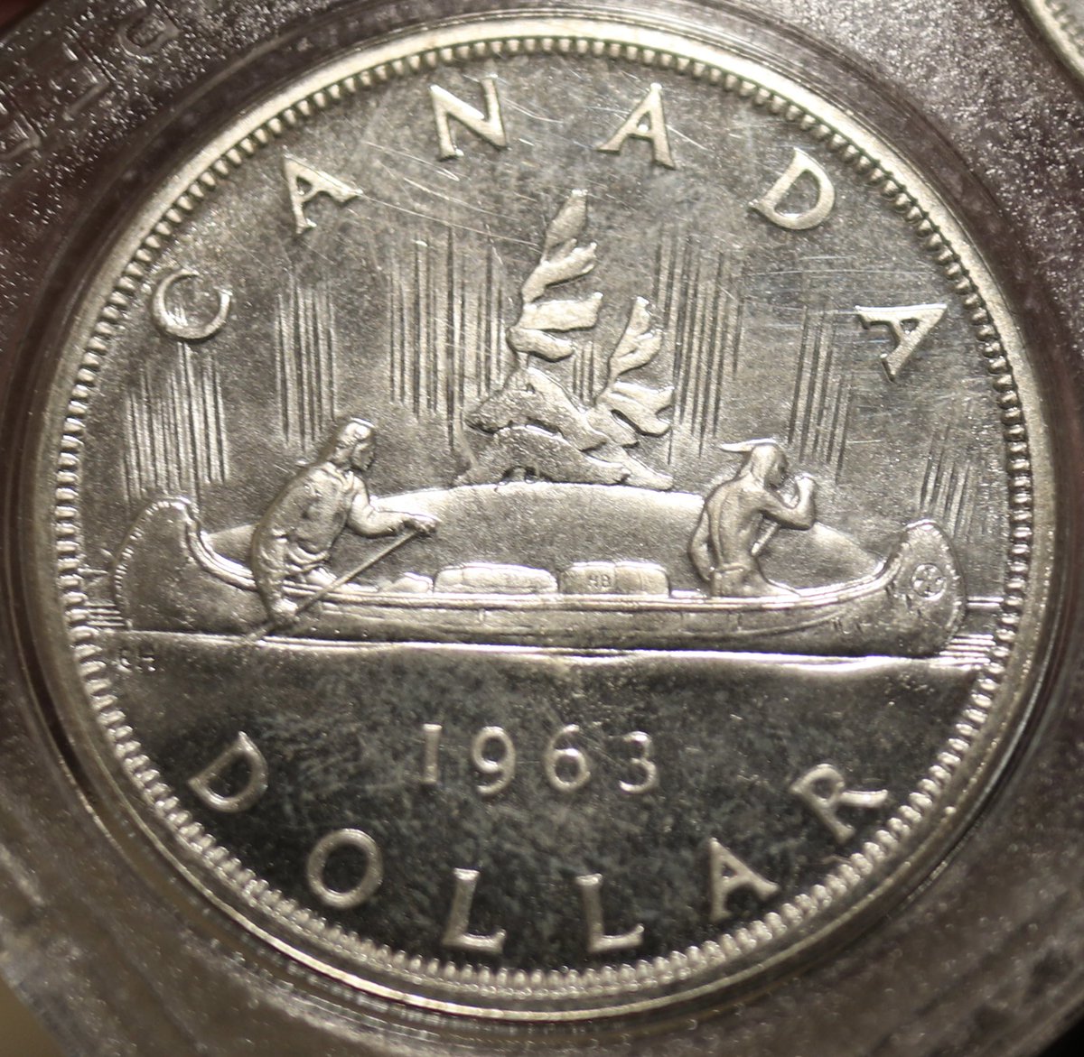 DogeTux's tweet photo. Emanuel Hahn designed the Canadian Voyageur Silver Dollar, which depicts a fur-trapper from the Hudson's Bay Company and a First Nations man in a canoe with the Northern Lights in the background. 
#silversqueeze #silverstacking #silverismoney #wallstreetsilver https://t.co/GvITlVp1Xc