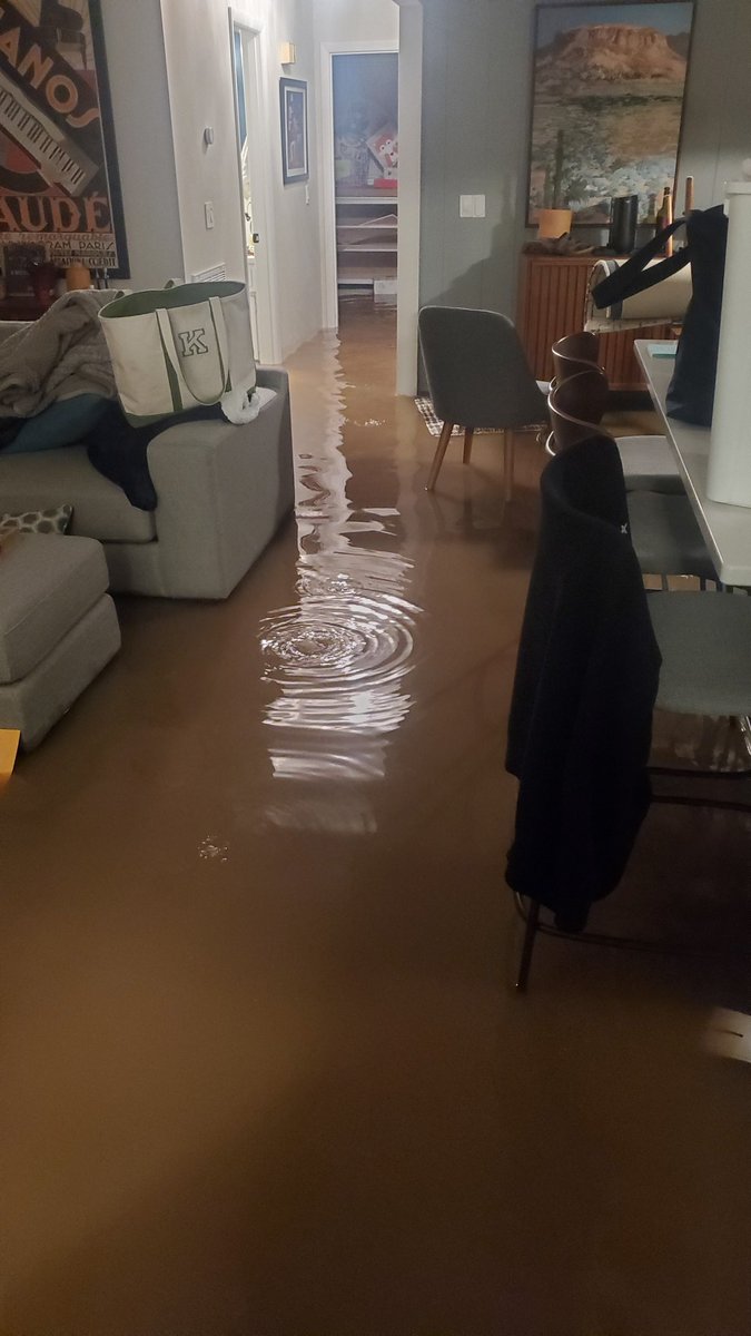 TheJamesMartin's tweet photo. This morning I looked out our front door and saw an ocean. In 15 min, our house had 4ft of water surrounding it, and 1.5ft inside. It was terrifying, but my pregnant wife and I made it out to a neighbor's rooftop! God is good and I'm thankful it wasn't any worse!! #Nashvilleflood https://t.co/ousKorUrsz