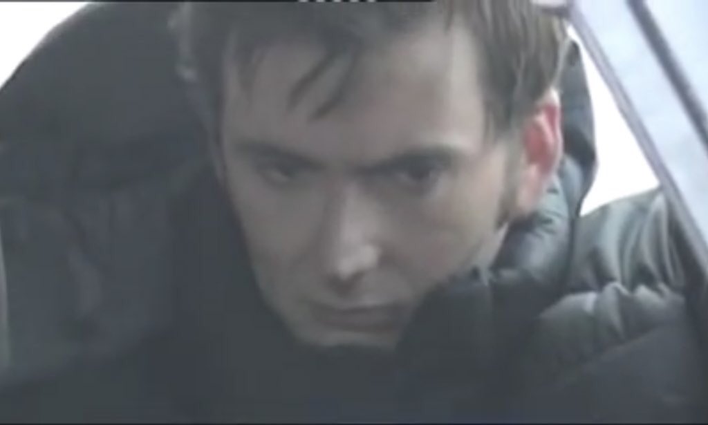 SafeSpaceDrWho's tweet photo. The fact that David Tennant physically removes himself from this scene and sits in the car while Billie delivers BREAKS my HEART 💔

His face 😭

#DoctorWho https://t.co/XdgIrGgYV1
