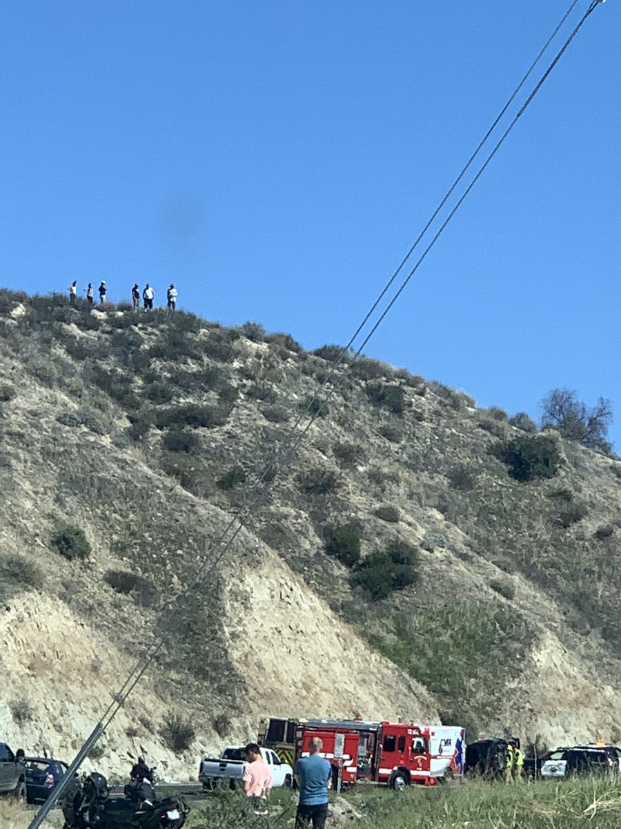 Bystanders look as both east and west bound lanes are closed on 79S towards Anza past Pauba due to overturned car.  #temecula #accident