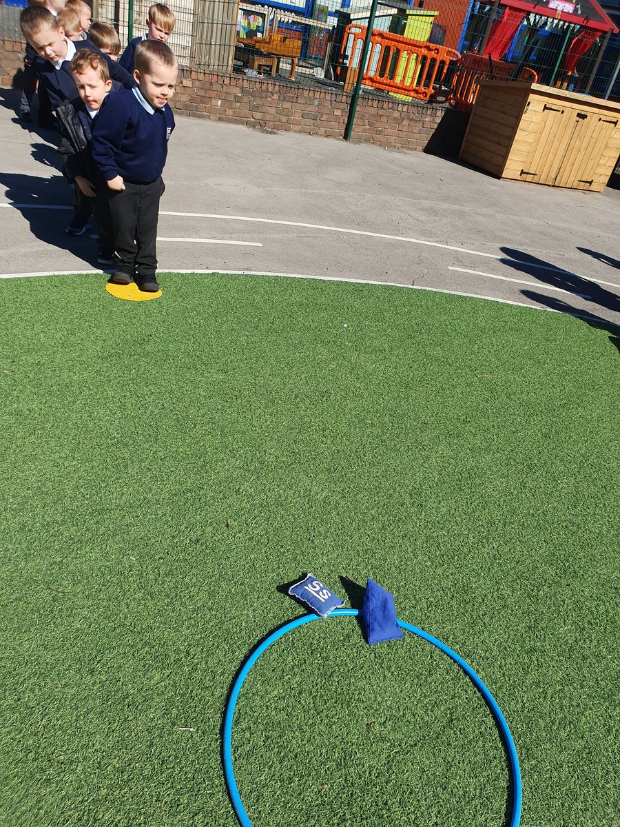 Miss_Wheatcroft's tweet photo. This afternoon we are practising our throwing. We are taking turns to throw bean bags into the hoops 🏆 @MrsMarks4 @WhitegateSch https://t.co/sKizDfvNJb