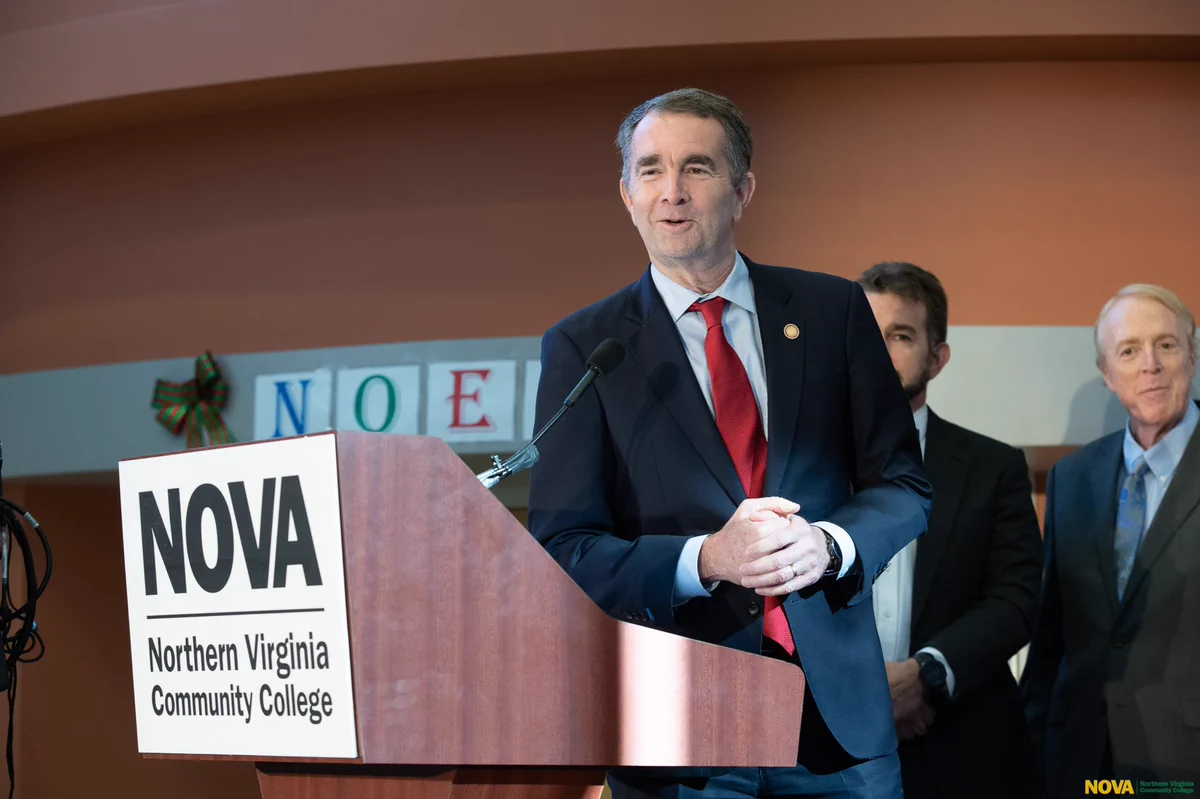 Governor Northman stands at a NOVA (Northern Virginia Community College) podium for the 2019 G3 Summit.