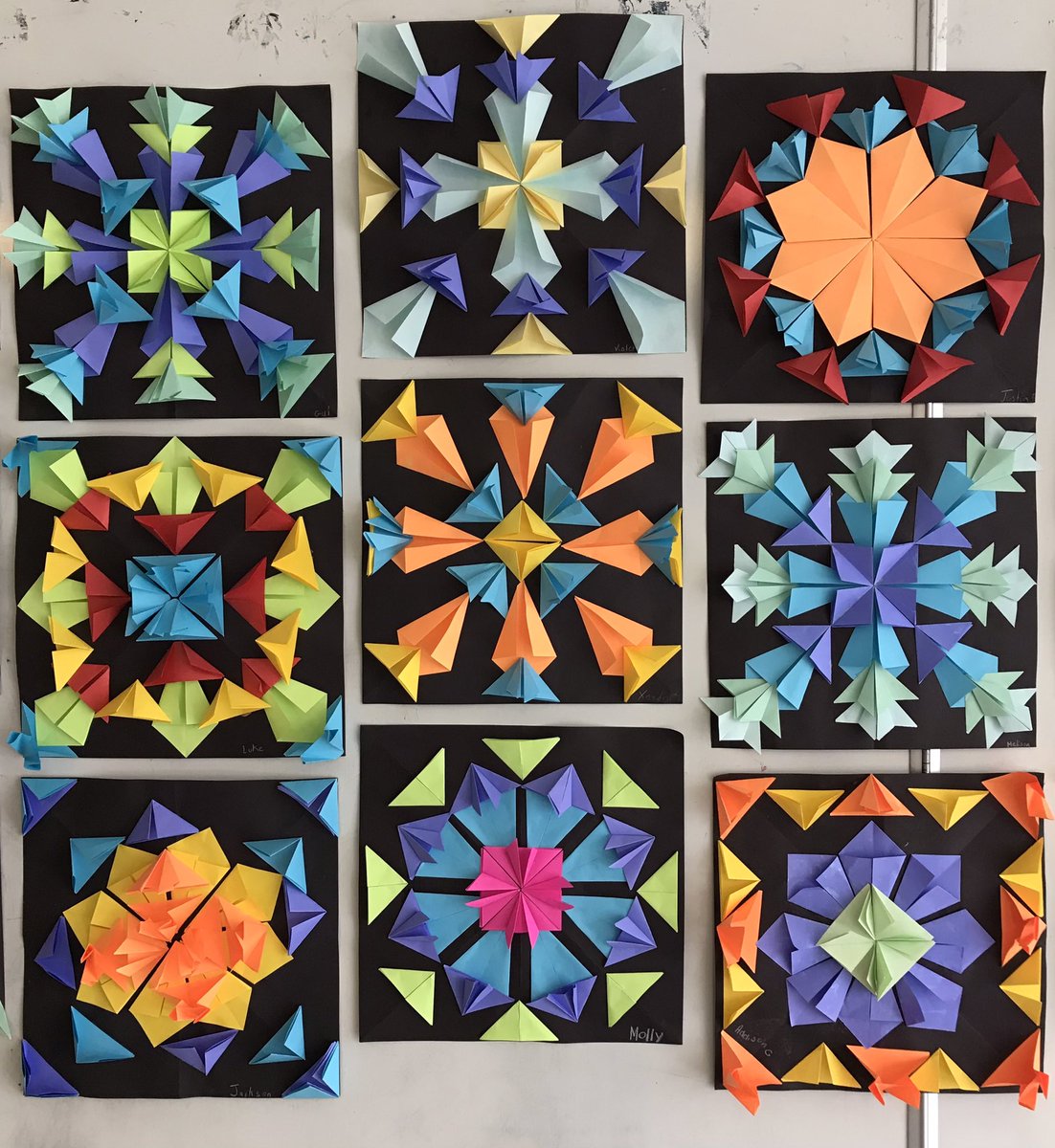PEESMsD's tweet photo. This paper folding symmetrical art created by students in 6D makes me smile every time I look at it. Cheerful and bright! https://t.co/VxT77O8Xpe