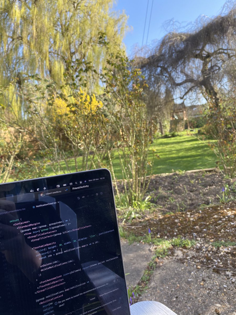 Photo of laptop with garden in background