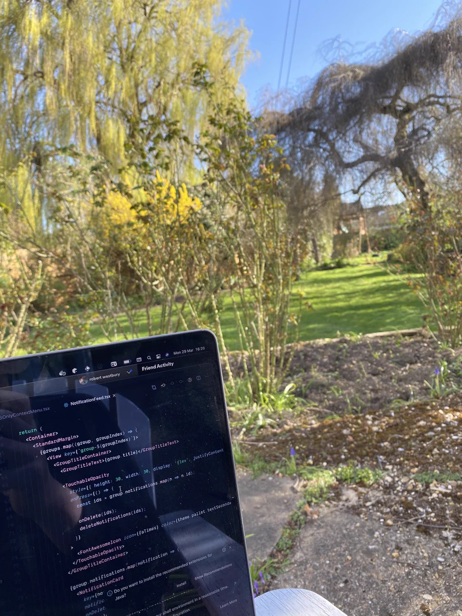 Photo of laptop with garden in background