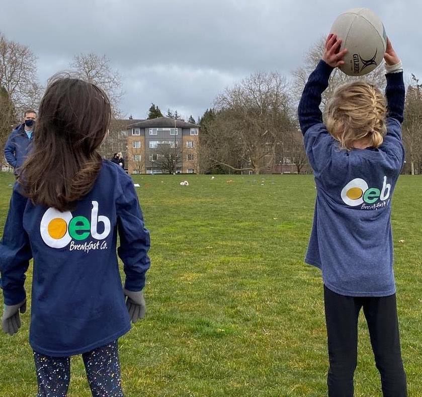 UBCWRugby's tweet photo. Thank you to @oeb_breakfast for these awesome minis shirts! Our amazing coaches have been enjoying Sunday's with these future rugby stars! 🤩 #minirugby #futurestarsofrugby https://t.co/TD1nuHeIkP