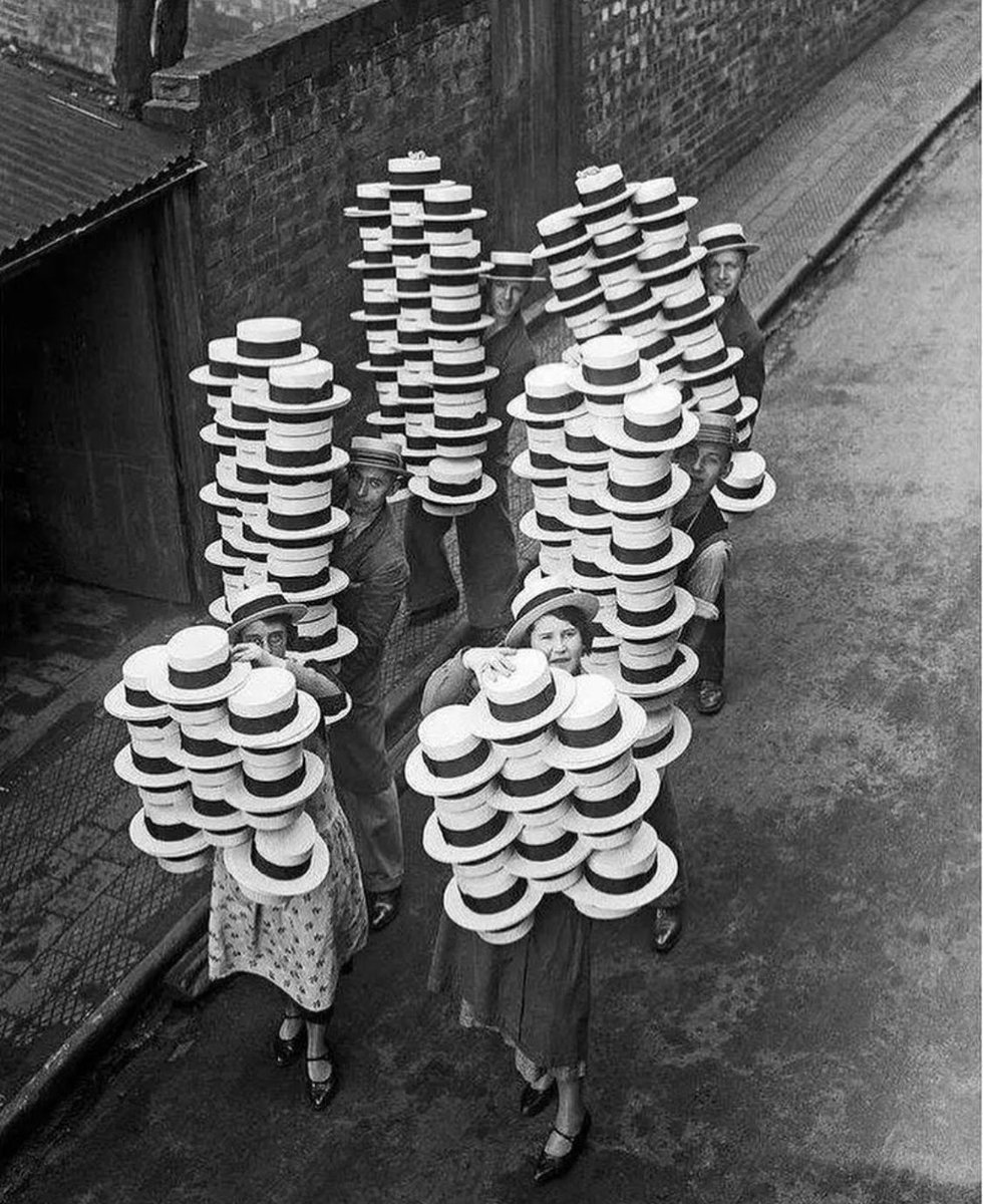 Workers carrying newly made straw hats in 1933 in Luton, Bedfordshire (UK)! 

Luton produced as many as 70 million hats a year in the 1930s and to this day Luton Town Football Club are known as The Hatters! Do you own a straw hat?