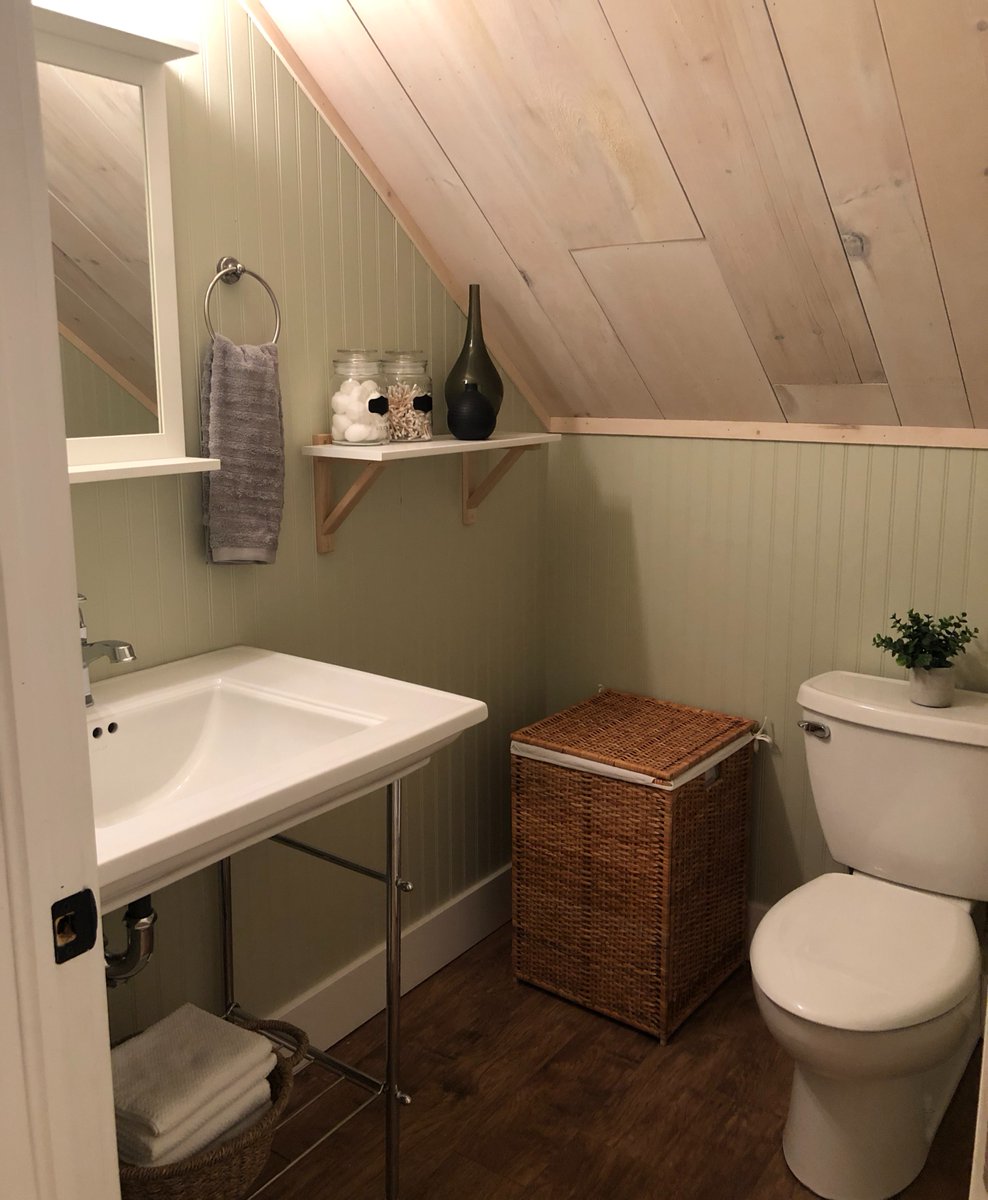 A small upstairs cottage bathroom designed to maximize the space while keeping the cottage feel.  This toilet is actually a rear ejection fixture as we could not drain vertically below (into the living room).  Solved a layout problem with product knowledge and expertise.