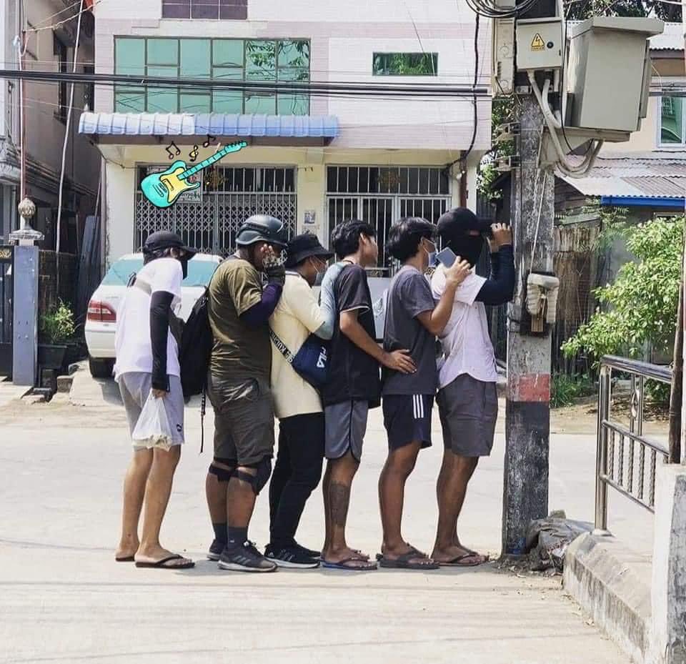 ZarChi77450524's tweet photo. A line of young protesters taking cover against  an electric power pole to avoid being shot.
We love you.
Please stay safe!
crd: (photo and cartoon)#WhatsHappeningInMaynmar https://t.co/u5L7rWQNkl