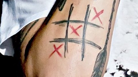 Tictactoe tattoo on the thigh