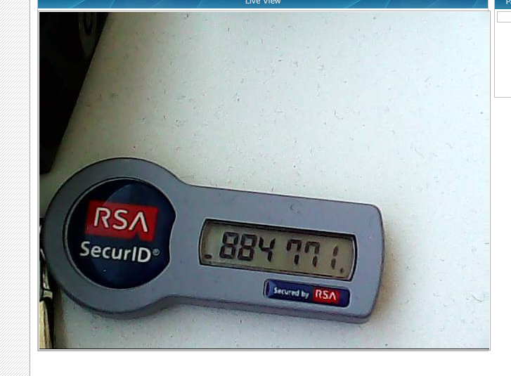 DoddsyLTD's tweet photo. Doing a little Shodan Safari, whilst I try to get to grips with it, and it made me laugh a little that someone has a security camera facing at their RSA Authenticator token 😂 https://t.co/R9pQz2OVAp