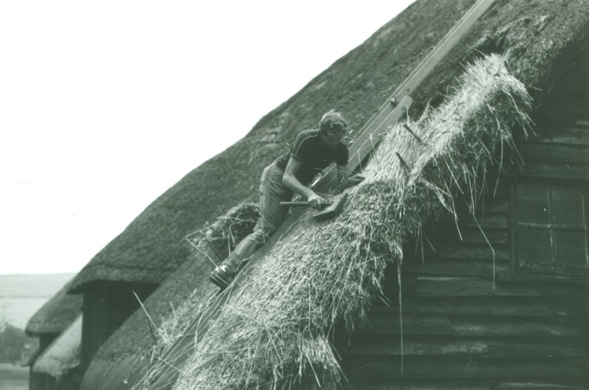 HeritageWSHC's tweet photo. This week we're exploring some #Wiltshire traditions starting with the craft of thatching. Traditionally straw was used, though today it's more likely to be a combed cereal thatch or water reed. Here's a #BowerChalke thatcher in action in 1982 #ExploreYourArchive #HBAHTraditions https://t.co/3AjfVTCNwb