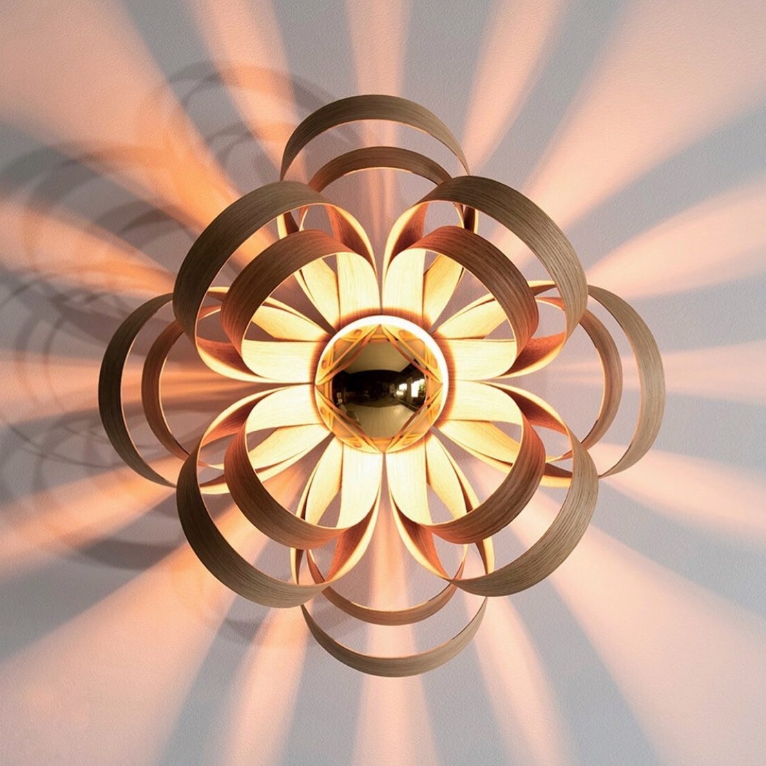 LumisonLighting's tweet photo. Hello to rays of sunshine inside and outside ☀️☀️

The @tomraffield Skipper wall lamp handcrafted in Cornwall from sixteen individual wooden petals. 

#skipperwalllight #lumisonlighting #brightideas #shopmillstreetoakham https://t.co/hjakdXdF2e