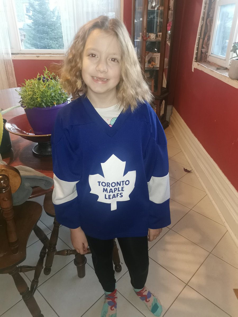 smartin_84's tweet photo. @MapleLeafs my girl on Jersey day for school she was a little disappointed in the game yesterday but she's still rocking it out like a true fan this morning. Even supporting the missing teeth 🤣 https://t.co/myxEMDZghs