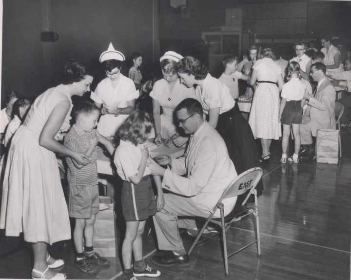 WichitaHistory's tweet photo. #Wichita children receive the #polio #vaccine at East High in 1954, part of field trials sponsored by the National Foundation for Infantile Paralysis (@MarchofDimes). #Photo from our #archives. @SedgwickCounty @CityofWichita #SupportLocalMuseums https://t.co/hlZrh1cgZh