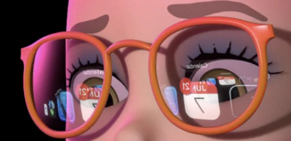 A memoji character wearing glasses is looking at a MacBook screen. UI elements can be seen reflected in the glasses.