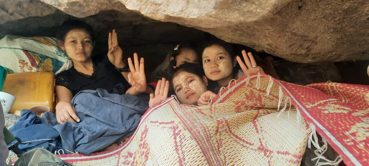 burmacampaignuk's tweet photo. Forced to flee into Thailand by the threat of jets bombing their village.

Then forced back into Karen State by the Thai government.

Unable to go home for fear of bombings.

Sheltering under rocks for safety.

Supporting CDM! https://t.co/Claq6IGRBq