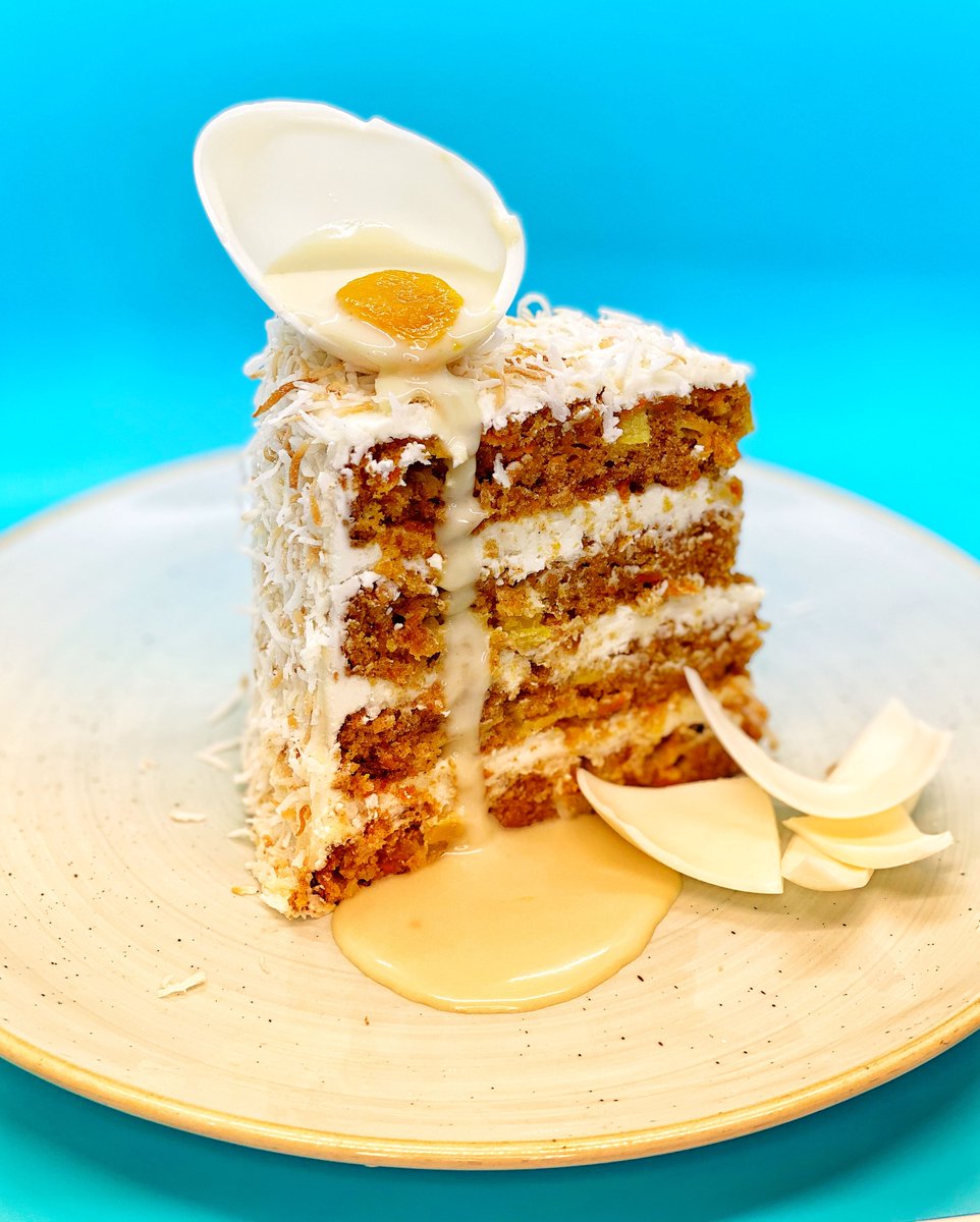 Is it #EasterWeekend yet? Dreaming of this PIÑA COLADA CARROT CAKE. 😋 Pineapple carrot cake layered with cream cheese frosting and toasted coconut. topped with a white chocolate egg filled with mango sauce and coconut cream. 🍍 🥕
 
Available only on April 2-4. Book a table NOW!