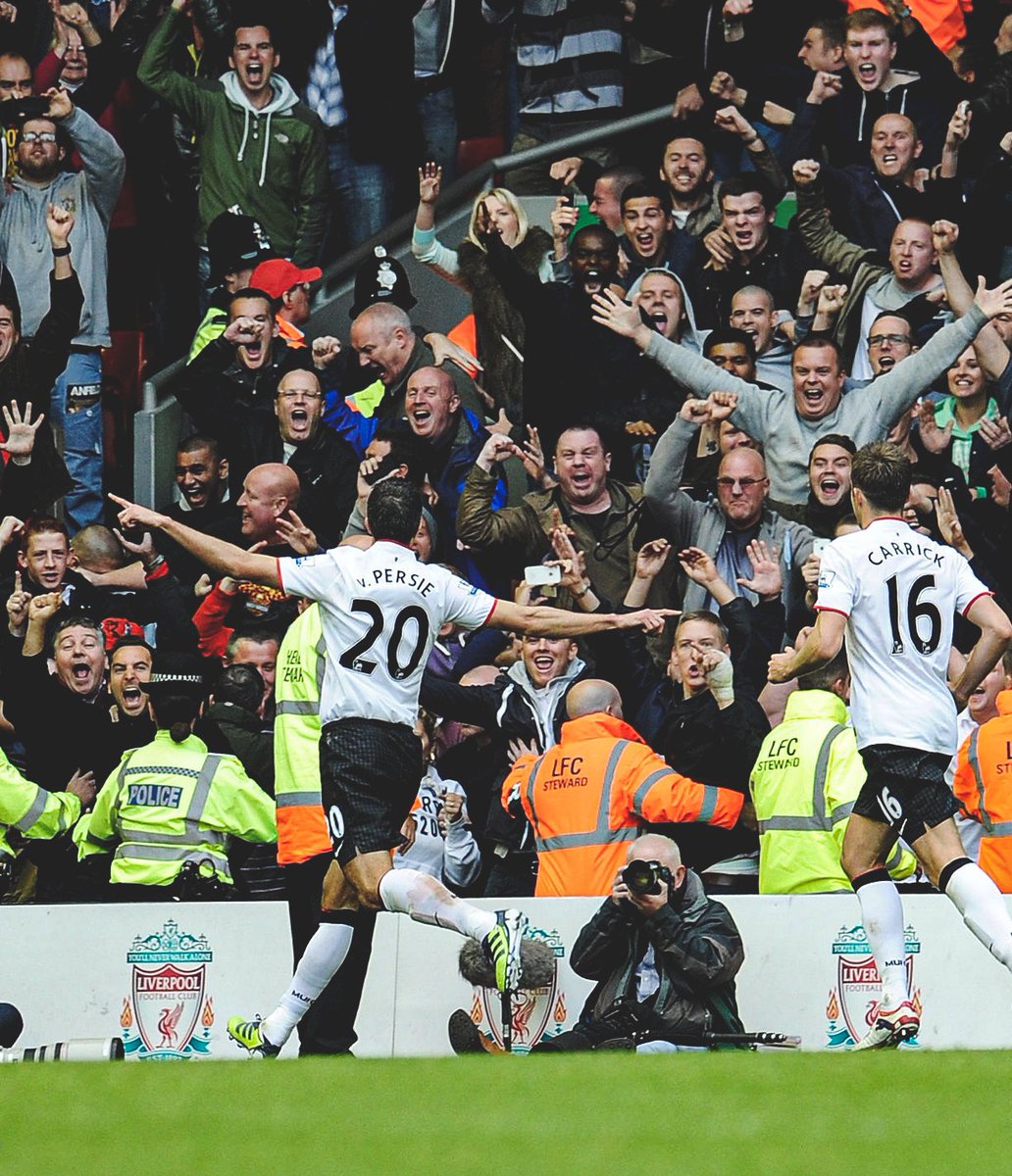 Robin Van Persie celebrates with the traveling Reds after scoring a late penalty to secure a 2-1 away win at Anfield, 2012.