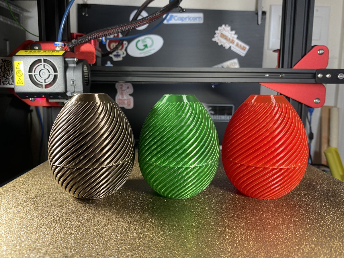 drewrog's tweet photo. Swirly eggs from @Clockspring3D. Printed in @Polyalchemy Elixir “Alpha Brass” and @PrintedSolid Jessie PLA Red and Green Ice. #3Dprinting #makes #hotmakes #eastermakes https://t.co/LfrLCcKygt