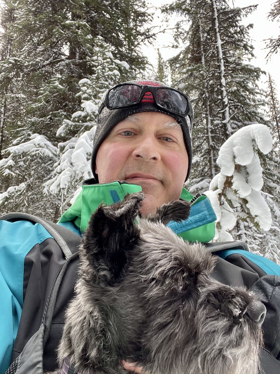 Snowshoeing on Maligne Lake. The dog needed to be in her carry pouch. #jasper #winterplayground