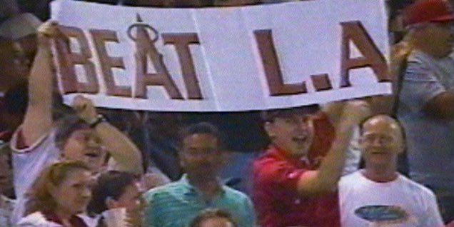 robrohm's tweet photo. @angelsgrandma3 @JoseMota05 @Markgubicza @lifeisgreatsut @MikeTrout @JessTara @PujolsFive @FoxSportsWest @Angels That’s so awesome! Congrats! My uncle, cousin, friend, and I were on the 2002 #RedDawnRises Story of The World Series Champs DVD when the #Angels were crushing the #Dodgers. They showed us with our #BeatLA sign. Hoping they take down The Dodgers tonight! https://t.co/elNKyZQEa6
