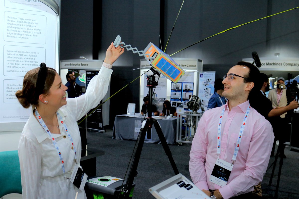 DefenceScience's tweet image. Defence scientist Paul Alvino and space science cadet Franke Agenbag discussing the CubeSat mirror technology at #AUSpaceForum. Franke is working on the technology for her engineering Honours project. We look forward to Franke joining us next year. #DefenceScience