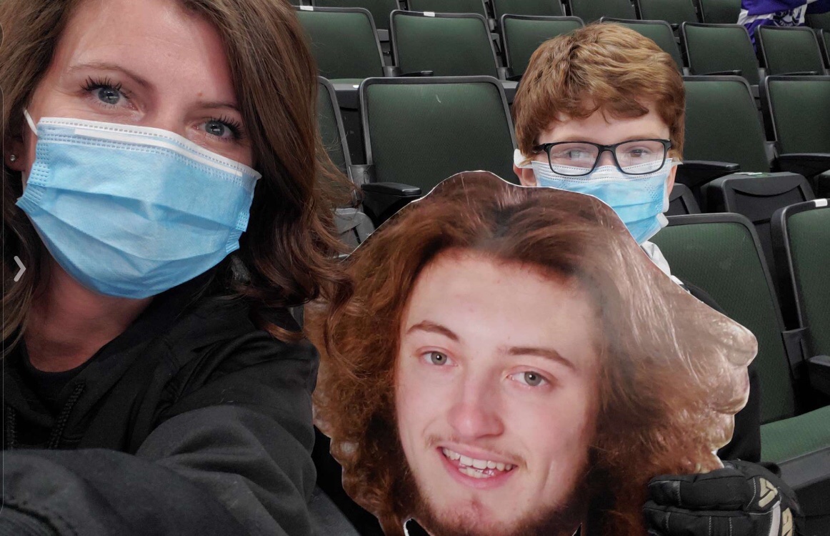 theashleyamy's tweet photo. @kstc45 Heather Fuller cheering on her brother #15 for the Little Falls Flyers! The entire family is so proud! Go Gunnar! Look at that hockey hair flow! #dqfansofthegame #mhshl #mnstatehockeytourney #2021 https://t.co/fnZBiwnUkj