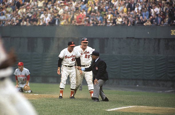 sigg20's tweet image. “Old Days”1st base coach George Staller and Boog Powell disagree with umpire Emmett Ashford’s call during the 1970 Reds-Orioles World Series at Memorial Stadium.#Orioles #Baltimore #Reds #MLB #1970s