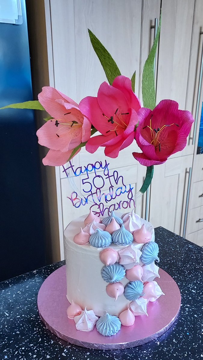 Made the cake &amp; the topper.  
Topper is crepe paper Lillies arranged on a circular transparent plastic food safe hoop.