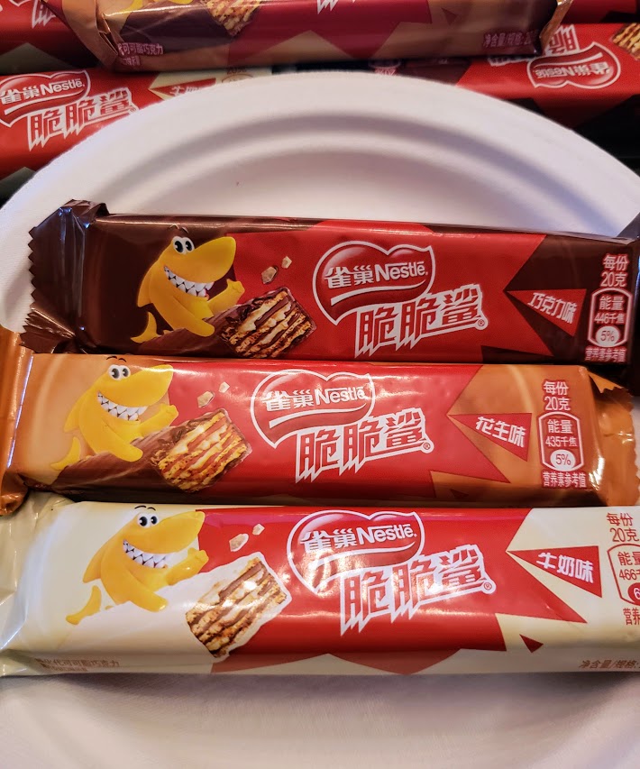 Food_Scientists's tweet photo. We tried these Nestle Crunchy Shark Wafer Bars, one of China's most popular snacks. Which one of us was underwhelmed (if any)? And exactly how many did Danny buy?  #fspod @podcast #reviews #choclate #candy #foodpics 
https://t.co/58lVXXJnaY https://t.co/QCwwJihWbP