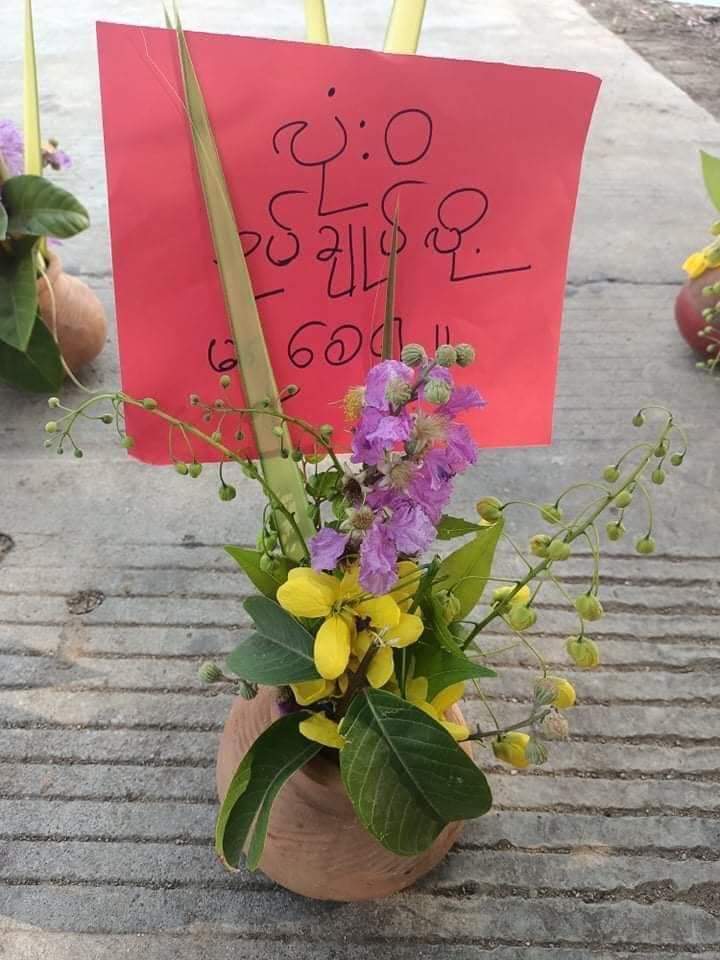 Bago residents marched against the military dictatorship on Apr. 13 holding Thingyan flower pots. Traditionally, pots of flowers—seven flowers representing the seven days of the week—are put out during Thingyan to welcome the New Year.  (Photo: CJ) #WhatsHappeningInMyanmar