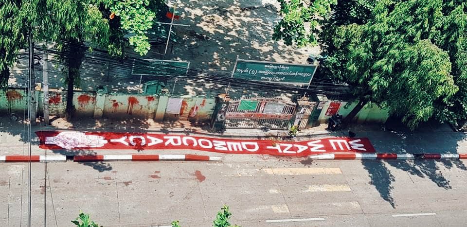 poemamhethar's tweet photo. A young man came placed this big banner there where one of our comrades was brutally shot dead to head. It was removed 15 mins later. 
But it says all “WE WANT DEMOCRACY” 
#WhatsHappeningInMyanmar #Apr13Coup https://t.co/DKGZruyBRe