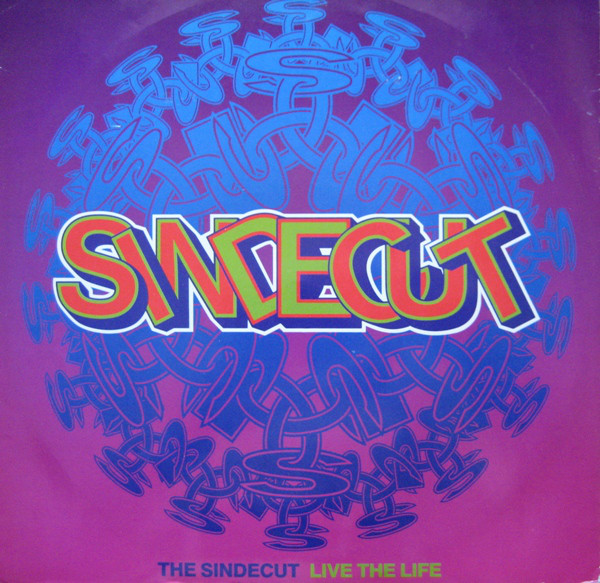 And the year before that, here's Sindecut performing Live The Life live on Dancedaze MCs Lyn E Lyn and Crazy Noddy were both reggae heads. The first Sindecut single in '88 sampled the Stalag riddim, and they continued to version it a few times