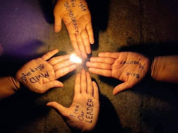 Merries12494's tweet photo. Night strike with a demonstration, words against military regime written on palms in Mudon town, Mon State. 
#Apr13Coup 
#WhatsHappeningInMyanmar https://t.co/NSI9OpymEC