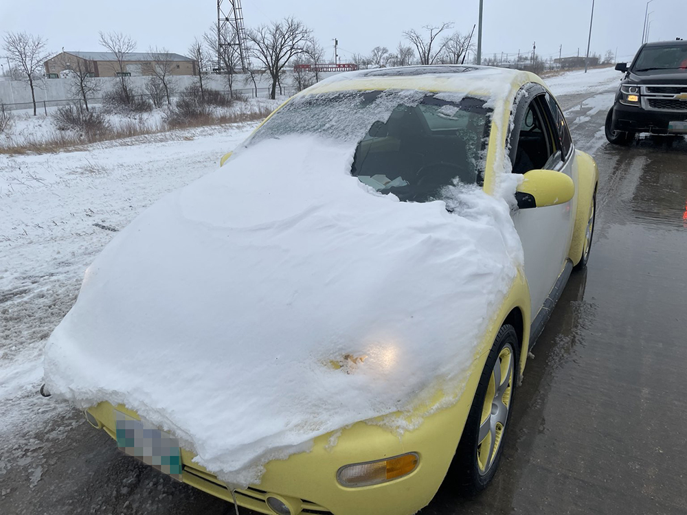 rcmpmb's tweet image. At 08:30 this morning, an officer patrolling the Perimeter Hwy (near Rosser Rd), saw this vehicle travelling southbound. 17yo driver issued a $113 fine for “Drive a vehicle when view obstructed by snow” &amp;amp; instructed to clear off the rest before proceeding. #noexcuses #rcmpmb