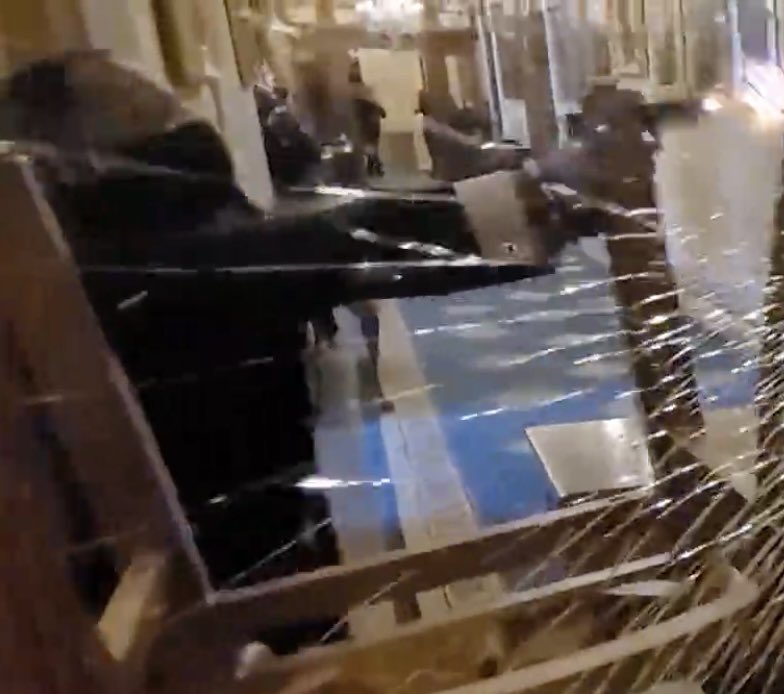gregkellyusa's tweet photo. Yeah. Who the hell is this guy anyway ?  The one who SHOT AND KILLED Ashley Babbitt. Unarmed.  We don’t have his name. All we know is no one is charging him with a crime. This is the moment he kills her. https://t.co/1MeLAMY5w5