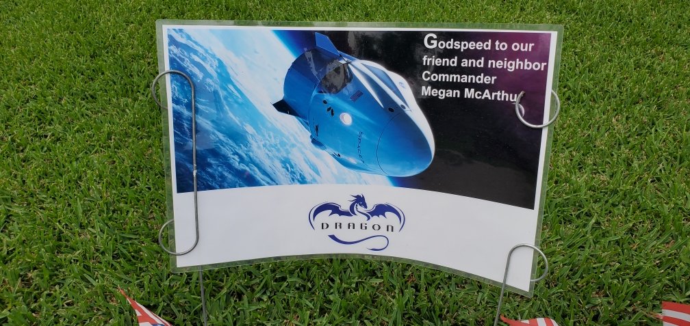 Astro_Megan's tweet photo. I have the best neighbors! Check out these signs they have put up ahead of my launch. (And the accidental promotion I received; hope my real commander @astro_kimbrough doesn't notice!😊) Astronauts have lived in this neighborhood for over 60 years. A wonderful place to call home. https://t.co/WccqAkV8rA