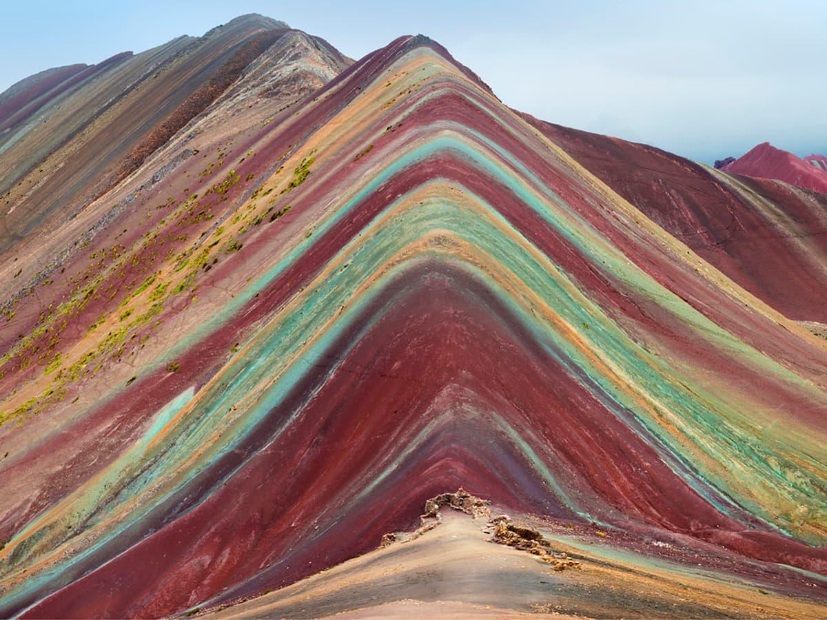 Today we're visiting an amazing natural site, Vinicunca, also spelled Vinikunka & also called Montaña de Siete Colores or Montaña de Colores (which means Mountain of Seven Colors & Mountain of Colors) or Rainbow Mountain. It's part of the Andes Mountains and is at 17,100 ft......