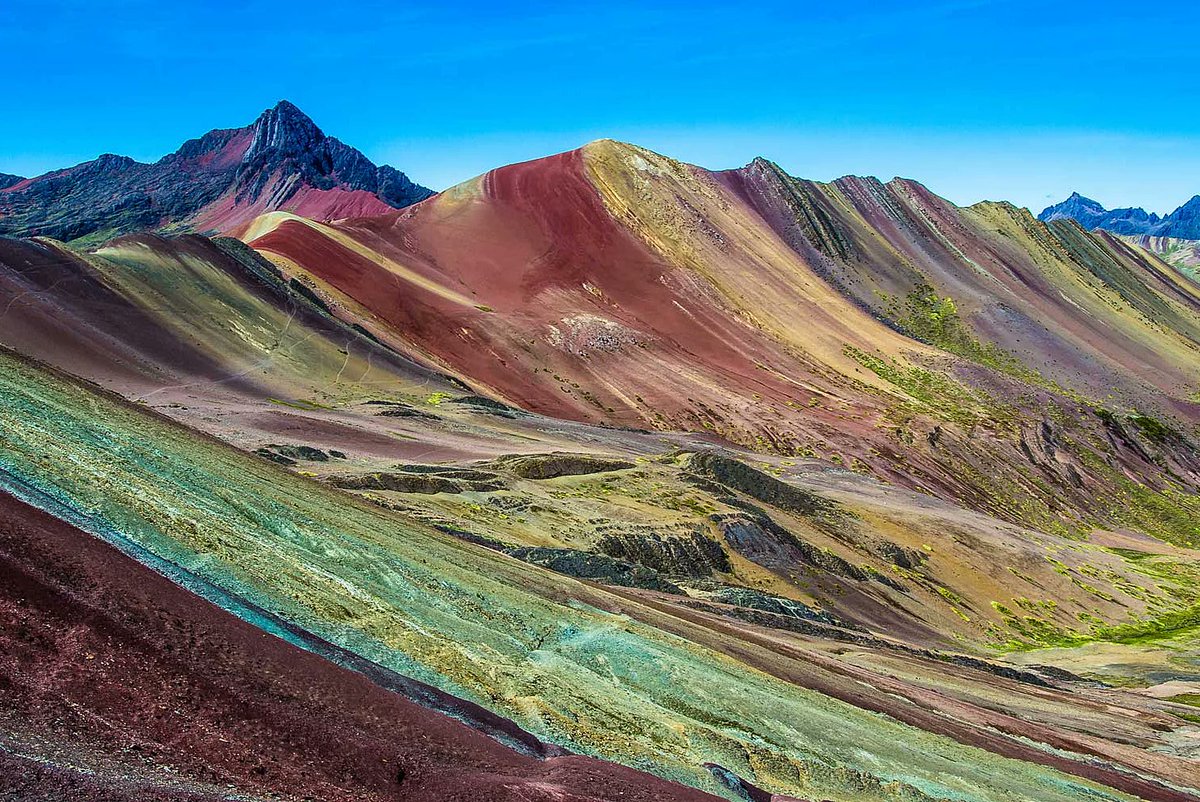 Today we're visiting an amazing natural site, Vinicunca, also spelled Vinikunka & also called Montaña de Siete Colores or Montaña de Colores (which means Mountain of Seven Colors & Mountain of Colors) or Rainbow Mountain. It's part of the Andes Mountains and is at 17,100 ft......