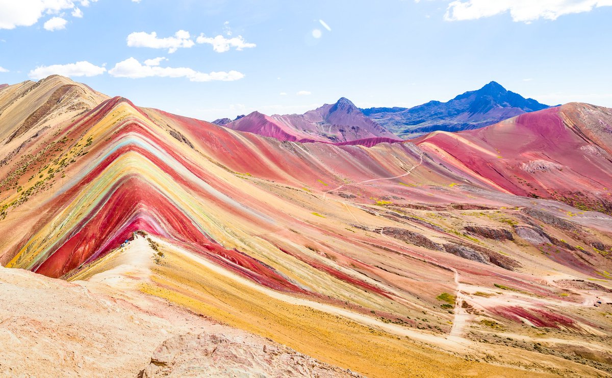 Today we're visiting an amazing natural site, Vinicunca, also spelled Vinikunka & also called Montaña de Siete Colores or Montaña de Colores (which means Mountain of Seven Colors & Mountain of Colors) or Rainbow Mountain. It's part of the Andes Mountains and is at 17,100 ft......