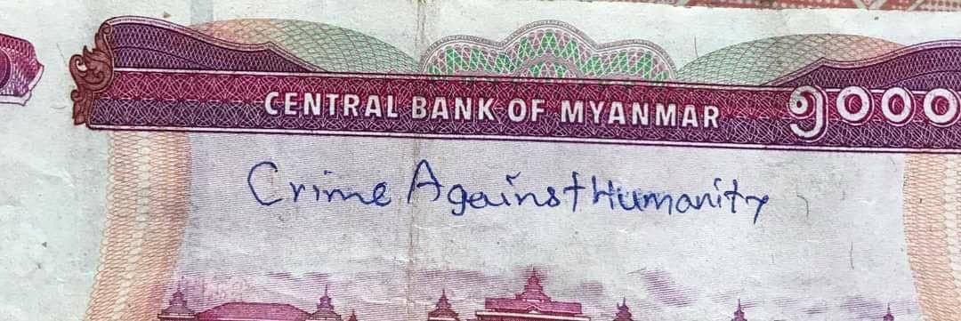 MayWongST's tweet photo. #Myanmar citizens have shown creativity in various ways to oppose Feb 1 #militarycoup. From painting opposition messages on streets to erecting female skirts to stop security forces from approaching, all were destroyed. Now they're voicing it on currency #WhatsHappeningInMyanmar https://t.co/buyihCz6EL