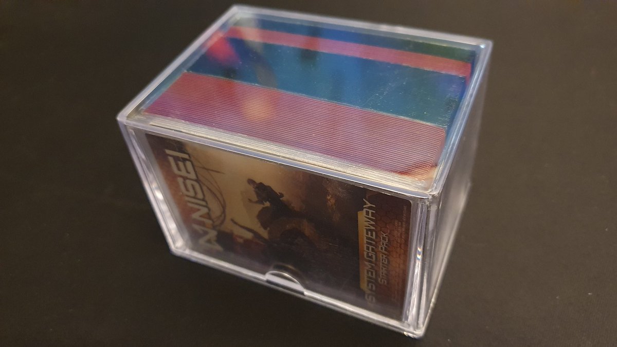 System Gateway in colored card sleeves and in a transparent box.